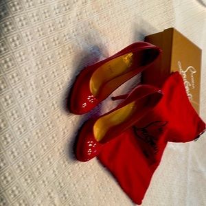 Louboutin simple red patent leather pump. Size 38.